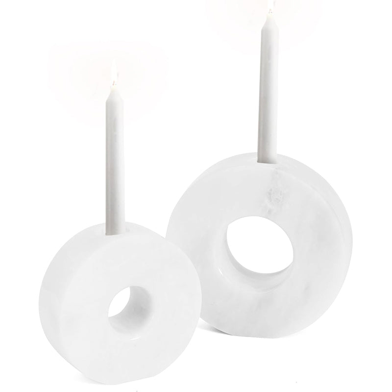 White circular earrings on a white background