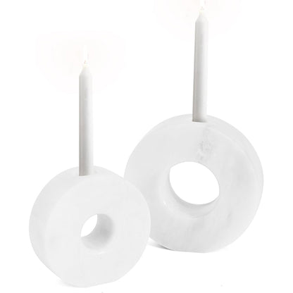 White circular earrings on a white background