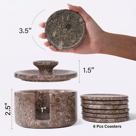 Set of stone coasters with dimensions and a hand holding one coaster.
