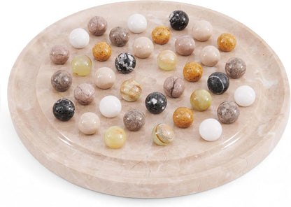 Marble-patterned platter with assorted marbles on a white background